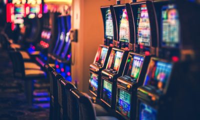 illuminated-slot-machines-in-darkroom-948708294-afaf089a8c7b4299aae1e1d70643a14c